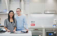 Couple happy with the kitchen equipment